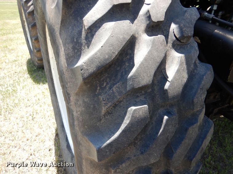 image for item LS9185 2002 New Holland TV140  4WD bi-directional tractor