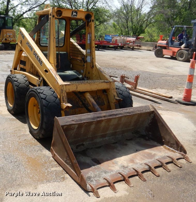 image for item DM7370 John Deere 675B  skid steer loader
