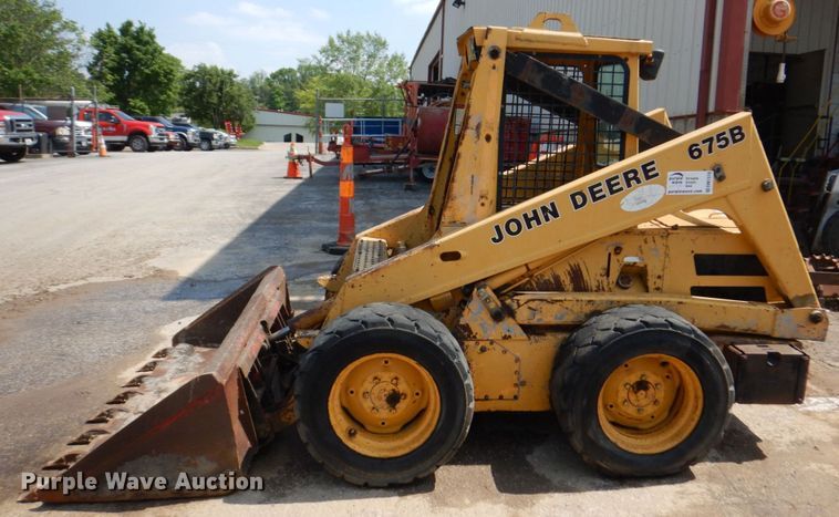 image for item DM7370 John Deere 675B  skid steer loader