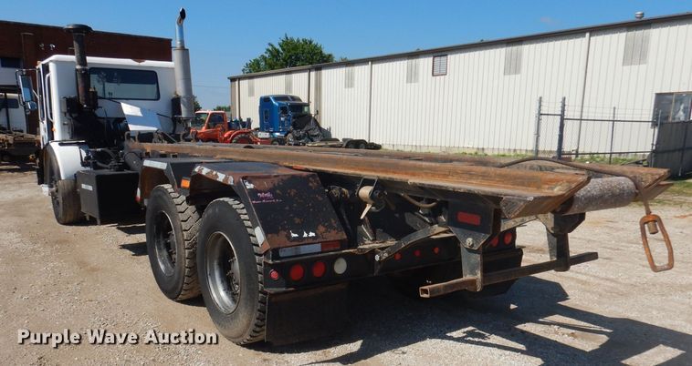 image for item DJ3829 1996 Mack MR  roll-off container truck