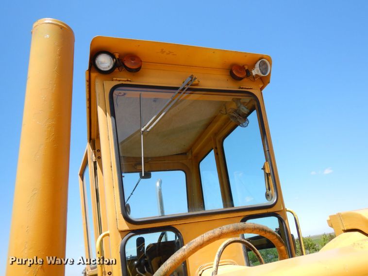 image for item MF9618 1981 John Deere 570A  rigid frame motor grader