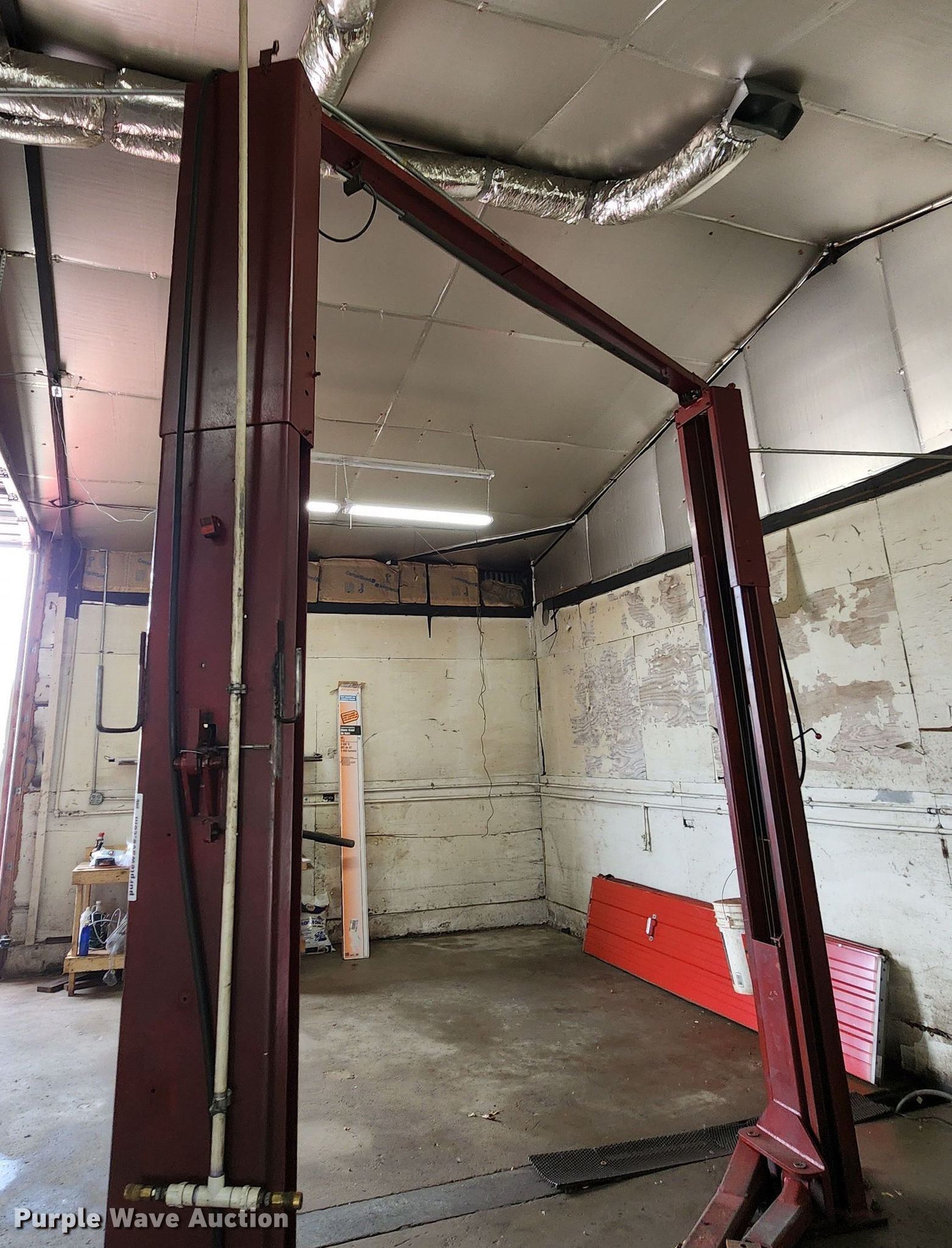 Two post automotive lift in Liberty, MO Item DL6592 sold Purple Wave