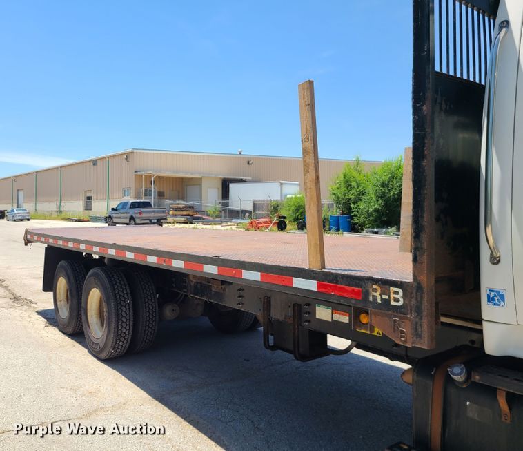 image for item JA9880 2004 Sterling L-Line  dump flatbed truck