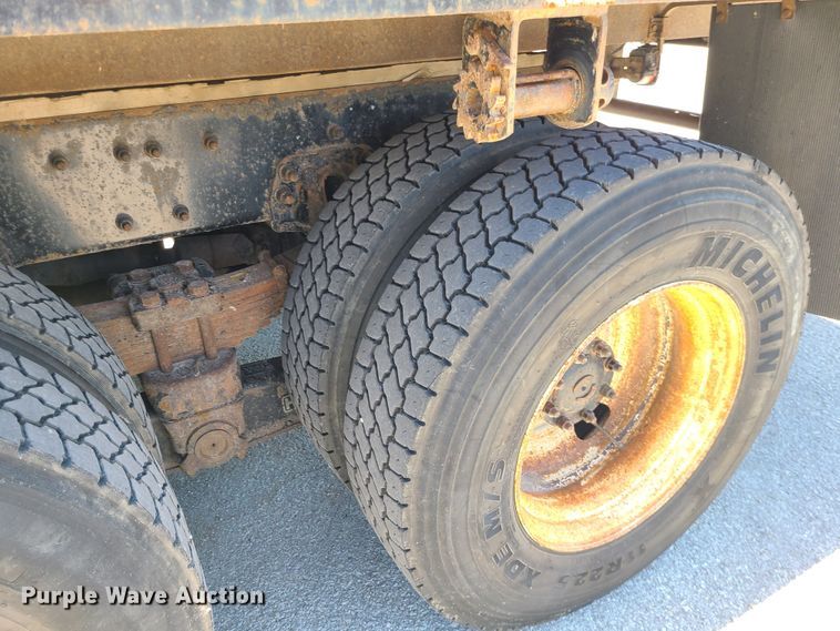 image for item JA9880 2004 Sterling L-Line  dump flatbed truck