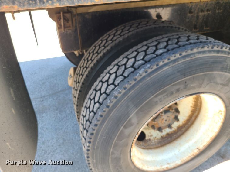 image for item JA9880 2004 Sterling L-Line  dump flatbed truck