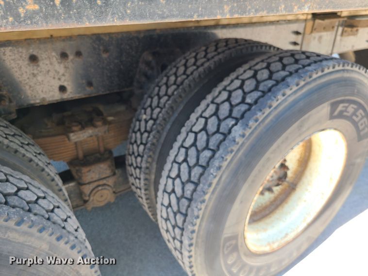 image for item JA9880 2004 Sterling L-Line  dump flatbed truck