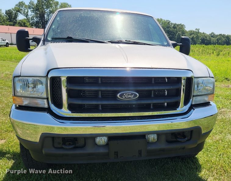 image for item JM9006 2002 Ford F250 Super Duty XLT  SuperCab flatbed pickup truck