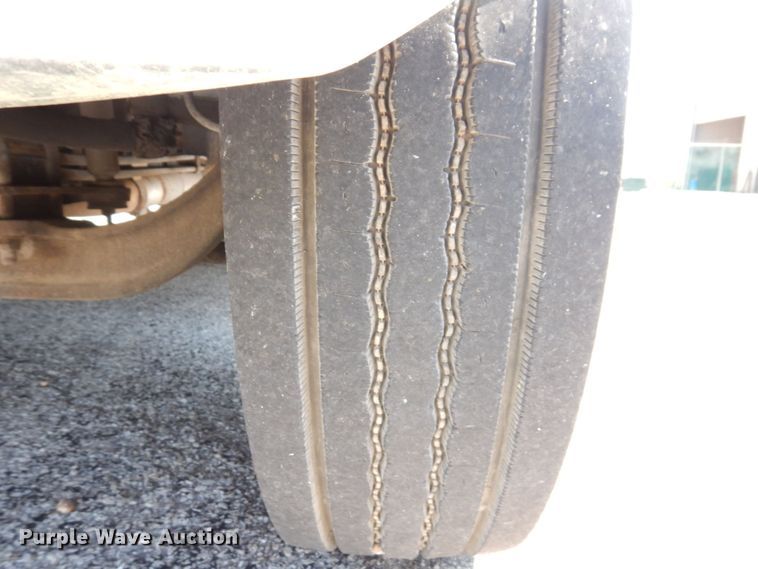 image for item KF9690 2005 GMC C7500  Crew Cab flatbed truck