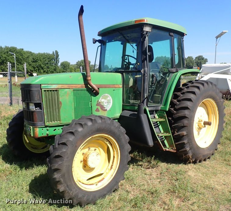 image for item IN9067 2002 John Deere 6605  MFWD tractor