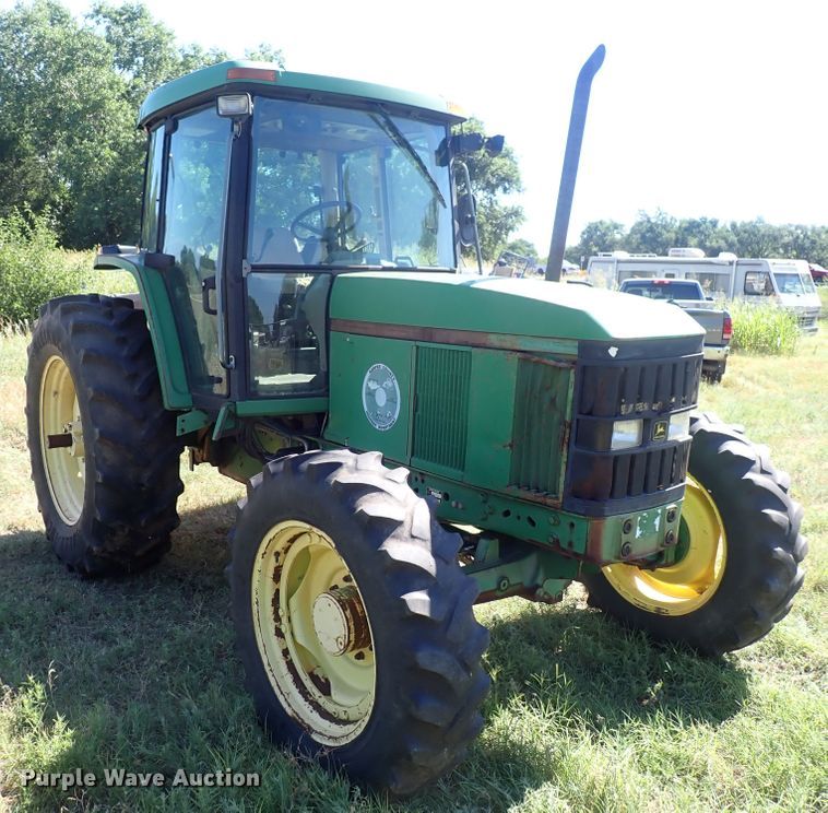 image for item IN9067 2002 John Deere 6605  MFWD tractor