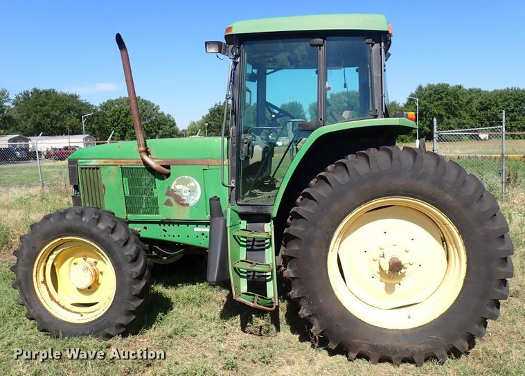 image for item IN9067 2002 John Deere 6605  MFWD tractor