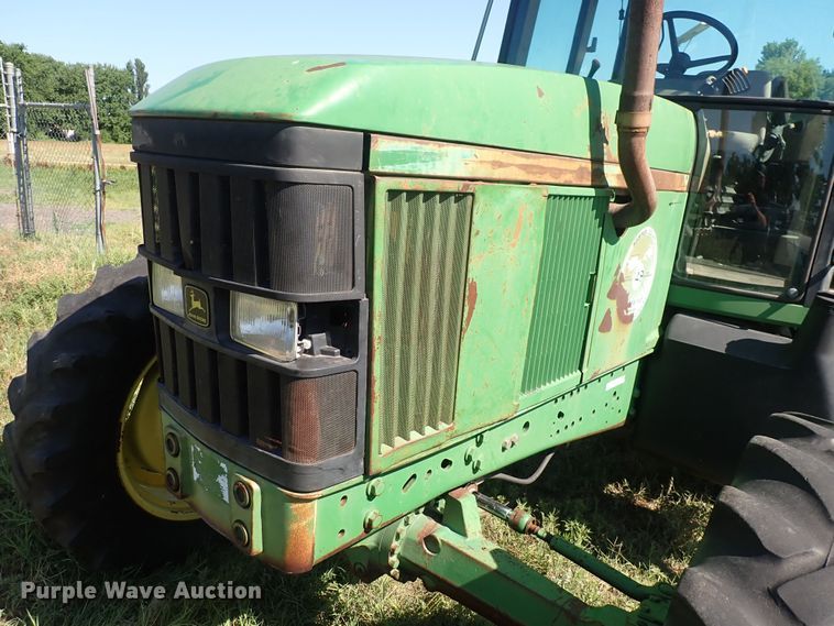 image for item IN9067 2002 John Deere 6605  MFWD tractor