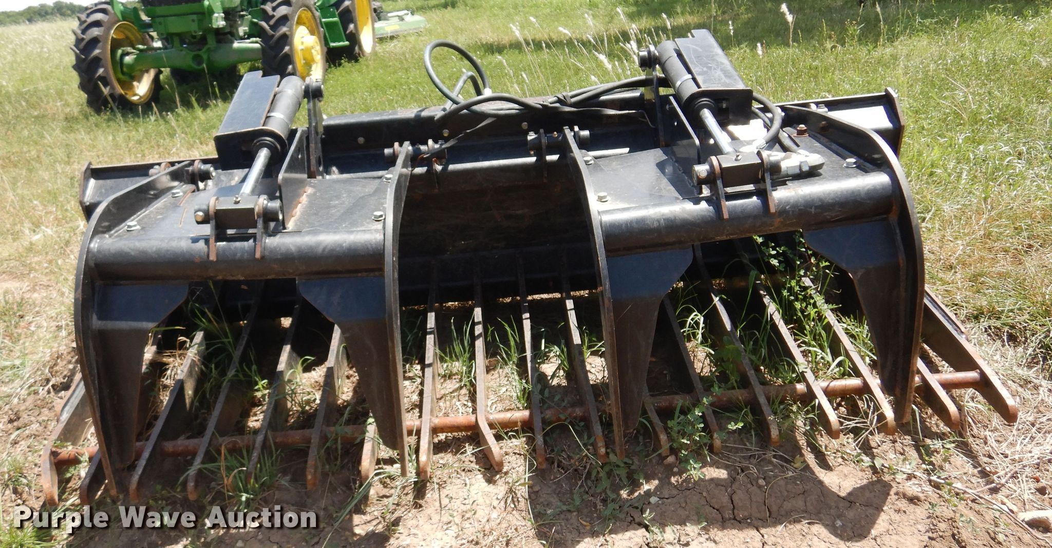 John Deere GT80 skid steer rock grapple bucket in Grenola, KS Item