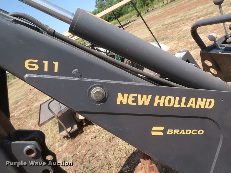 image for item JR9418 New Holland 611  backhoe attachment