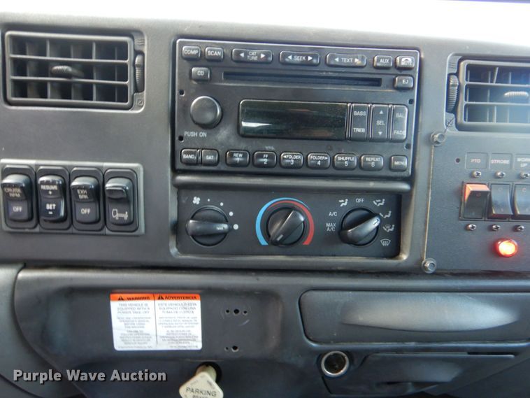 image for item DO1484 2010 Ford F650 Super Duty  SuperCab rollback truck