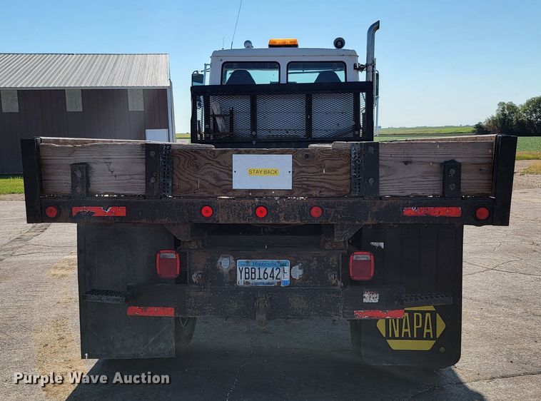 image for item JC9704 2001 Freightliner FL70  flatbed truck