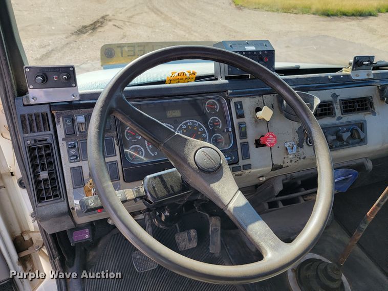 image for item JC9704 2001 Freightliner FL70  flatbed truck