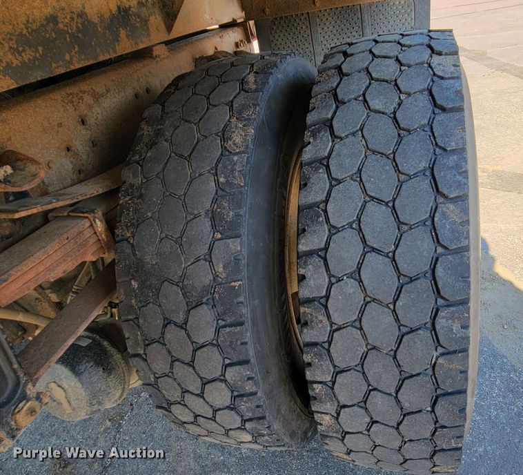 image for item JC9704 2001 Freightliner FL70  flatbed truck