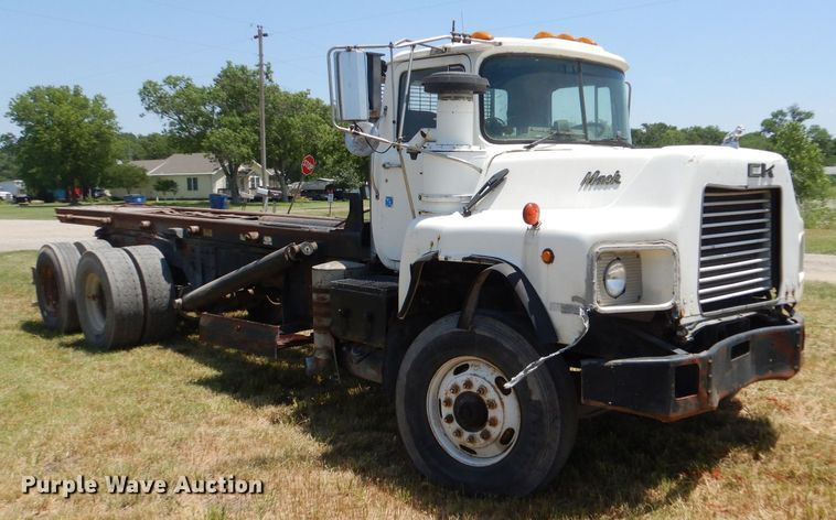 image for item LP9373 1999 Mack 600 DM Maxidyne  roll-off container truck