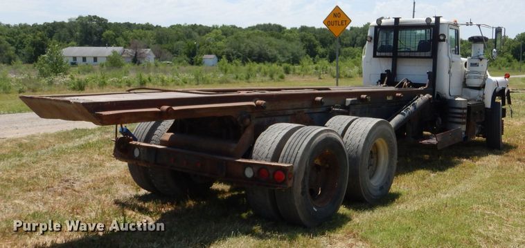 image for item LP9373 1999 Mack 600 DM Maxidyne  roll-off container truck