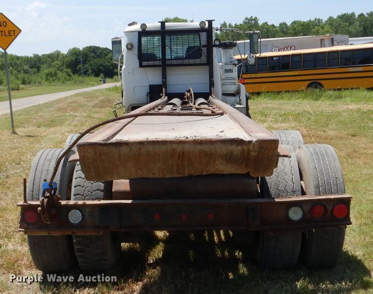 image for item LP9373 1999 Mack 600 DM Maxidyne  roll-off container truck