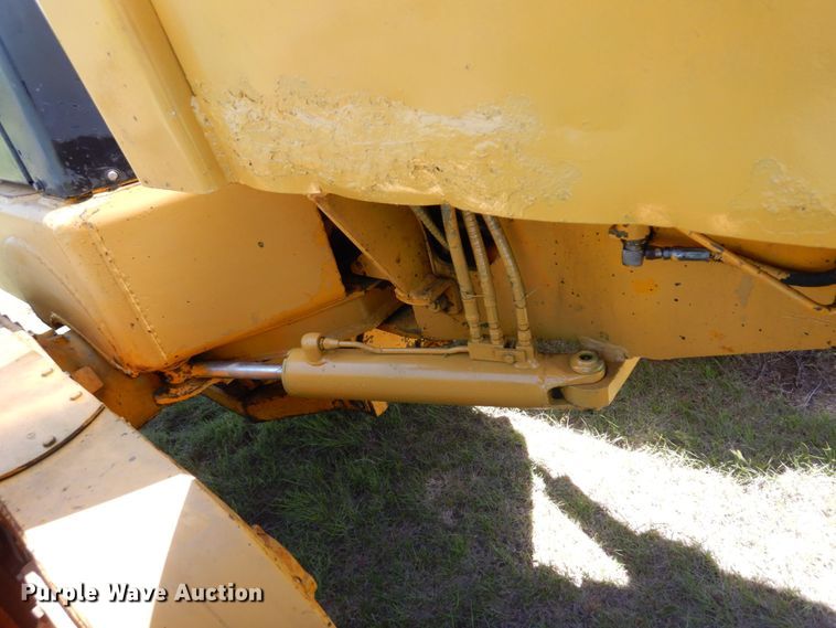 image for item MF9618 1981 John Deere 570A  rigid frame motor grader