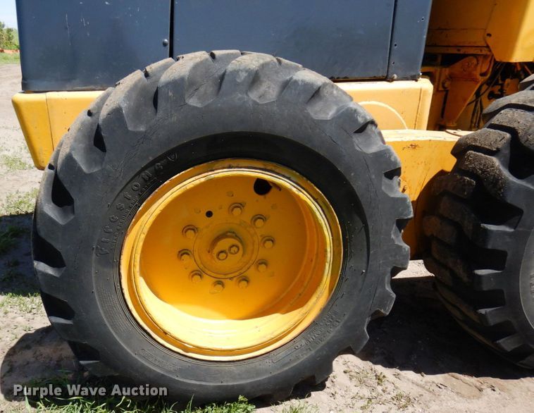 image for item MF9618 1981 John Deere 570A  rigid frame motor grader