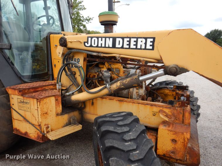 image for item KP9384 1998 John Deere 710D  backhoe