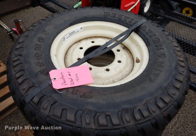 (4) Firestone Destination M/T 235/85R16 skid steer tires and wheels in