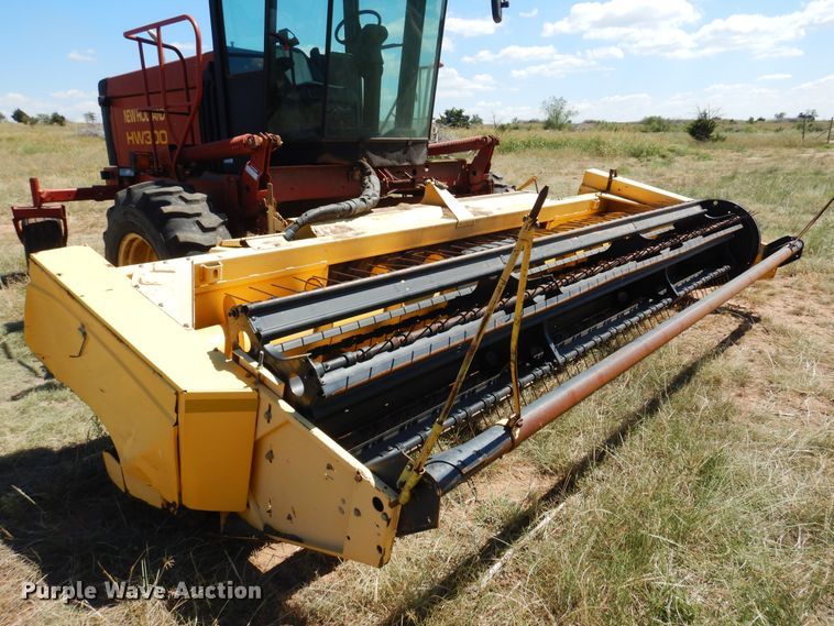 image for item DB7818 2002 New Holland HW300  windrower