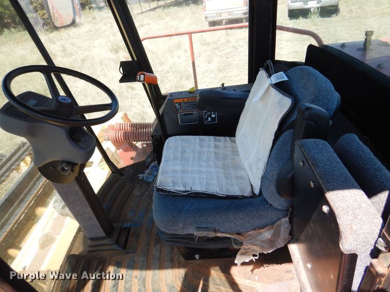 image for item DB7818 2002 New Holland HW300  windrower