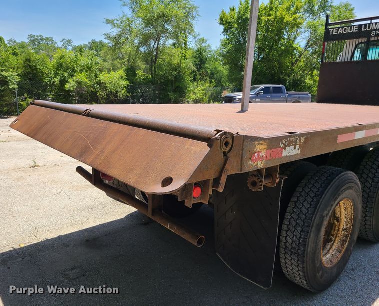 image for item JA9878 2004 Sterling L-Line  dump flatbed truck