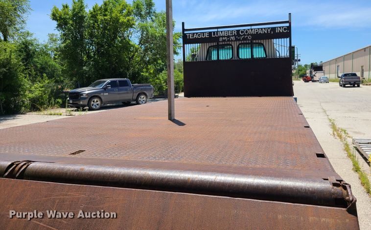 image for item JA9878 2004 Sterling L-Line  dump flatbed truck