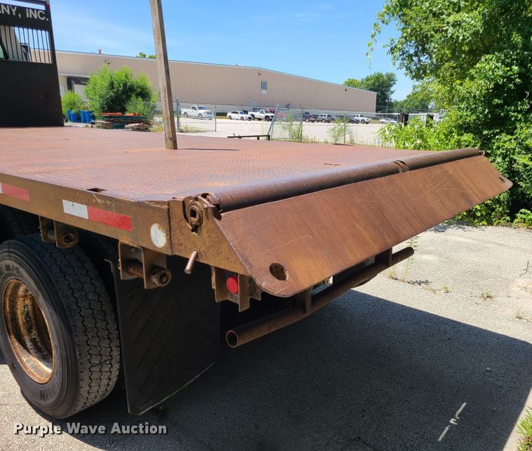 image for item JA9878 2004 Sterling L-Line  dump flatbed truck