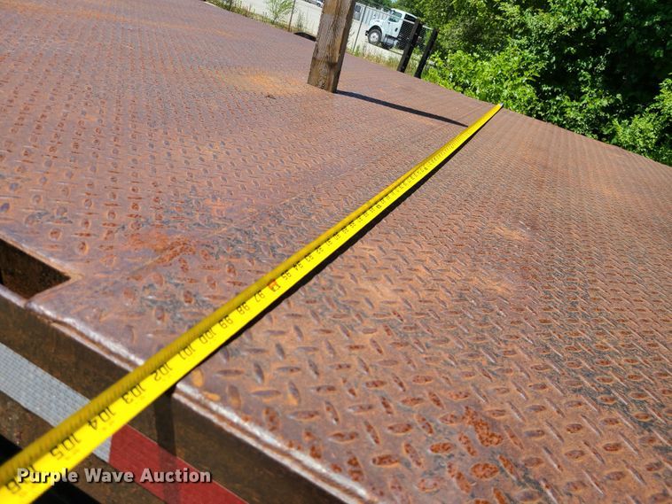 image for item JA9878 2004 Sterling L-Line  dump flatbed truck