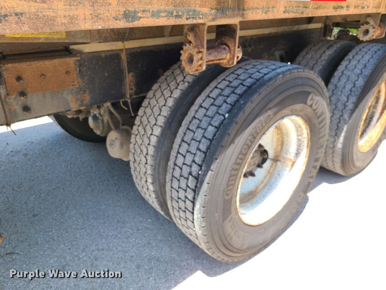 image for item JA9878 2004 Sterling L-Line  dump flatbed truck