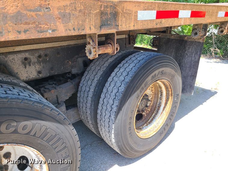 image for item JA9878 2004 Sterling L-Line  dump flatbed truck