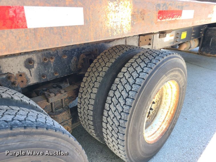 image for item JA9878 2004 Sterling L-Line  dump flatbed truck