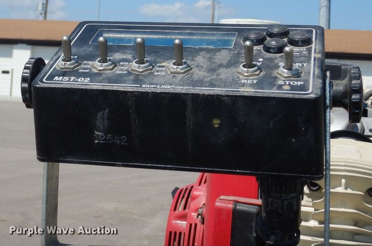 image for item LR9882 EZ-Liner AL-120  paint striper with Jim's utility trailer