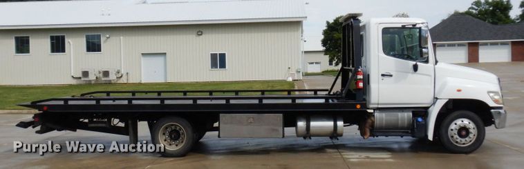 image for item MH9157 2012 Hino 268A  rollback truck