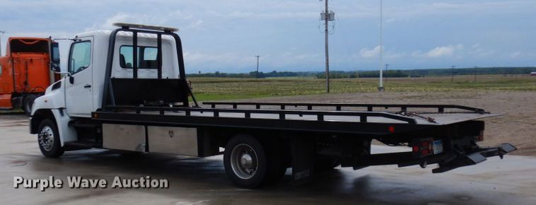 image for item MH9157 2012 Hino 268A  rollback truck