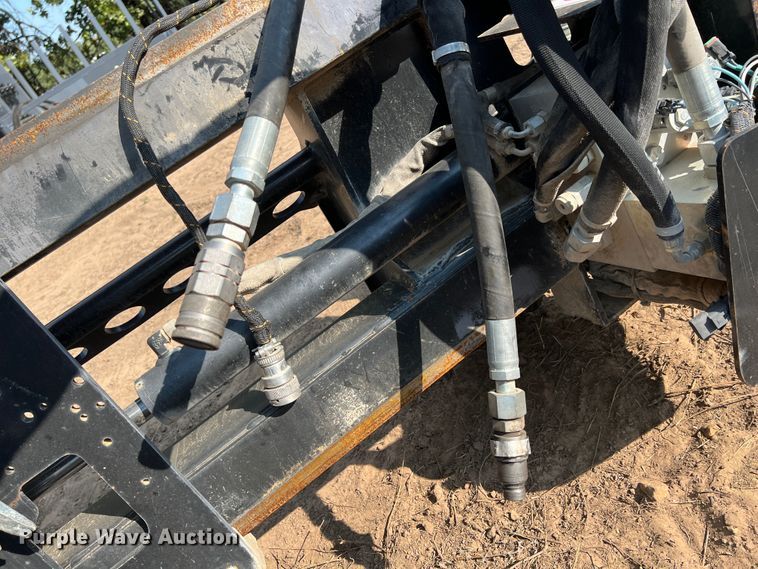 image for item IA9182 2012 Caterpillar SW460B-80  skid steer rock saw