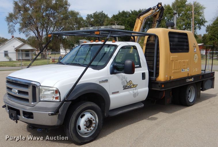 image for item LB9999 2005 Ford F550 Super Duty XLT  flatbed truck with boom mower