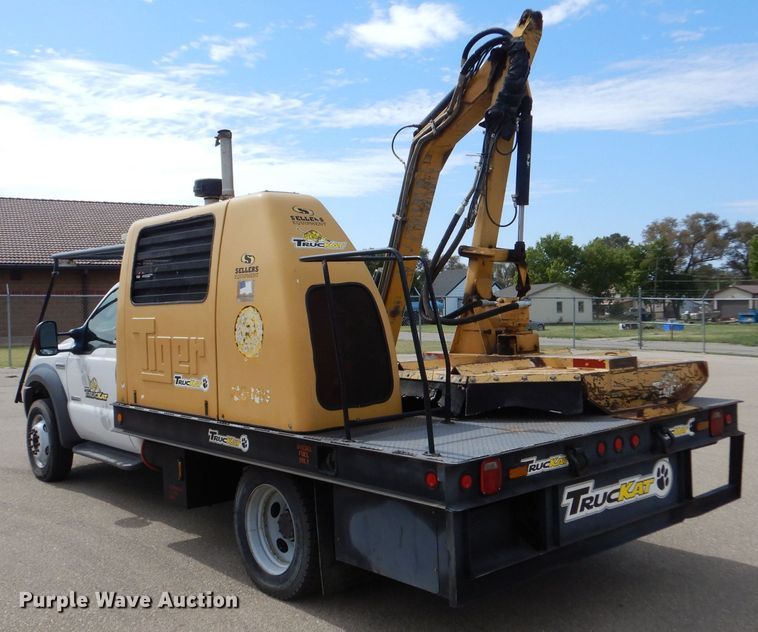 image for item LB9999 2005 Ford F550 Super Duty XLT  flatbed truck with boom mower