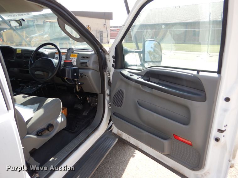 image for item LB9999 2005 Ford F550 Super Duty XLT  flatbed truck with boom mower