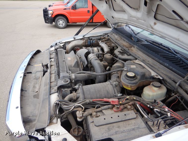 image for item LB9999 2005 Ford F550 Super Duty XLT  flatbed truck with boom mower