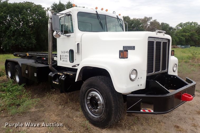 image for item DQ2942 1977 International Paystar 5000  roll-off container truck