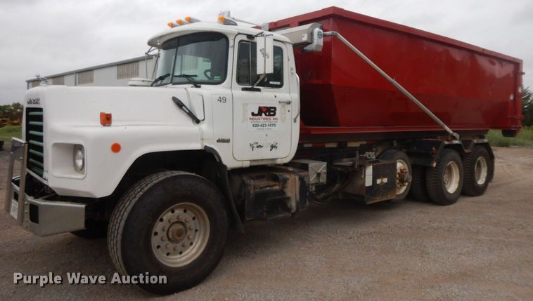 image for item HF9380 2004 Mack DM690S  roll-off container truck