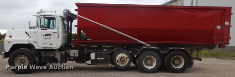 image for item HF9380 2004 Mack DM690S  roll-off container truck