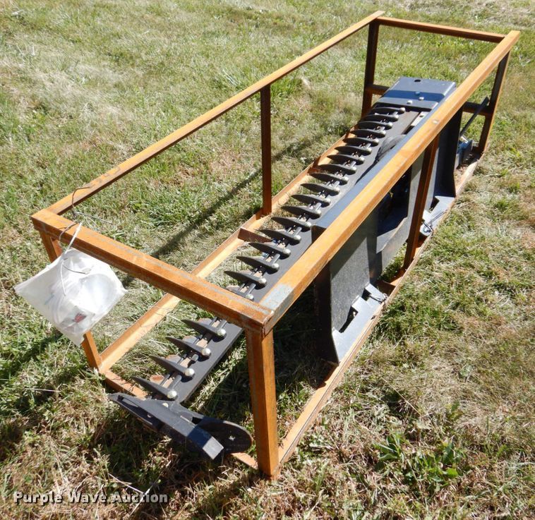 image for item JL9932 Wolverine  skid steer sickle mower